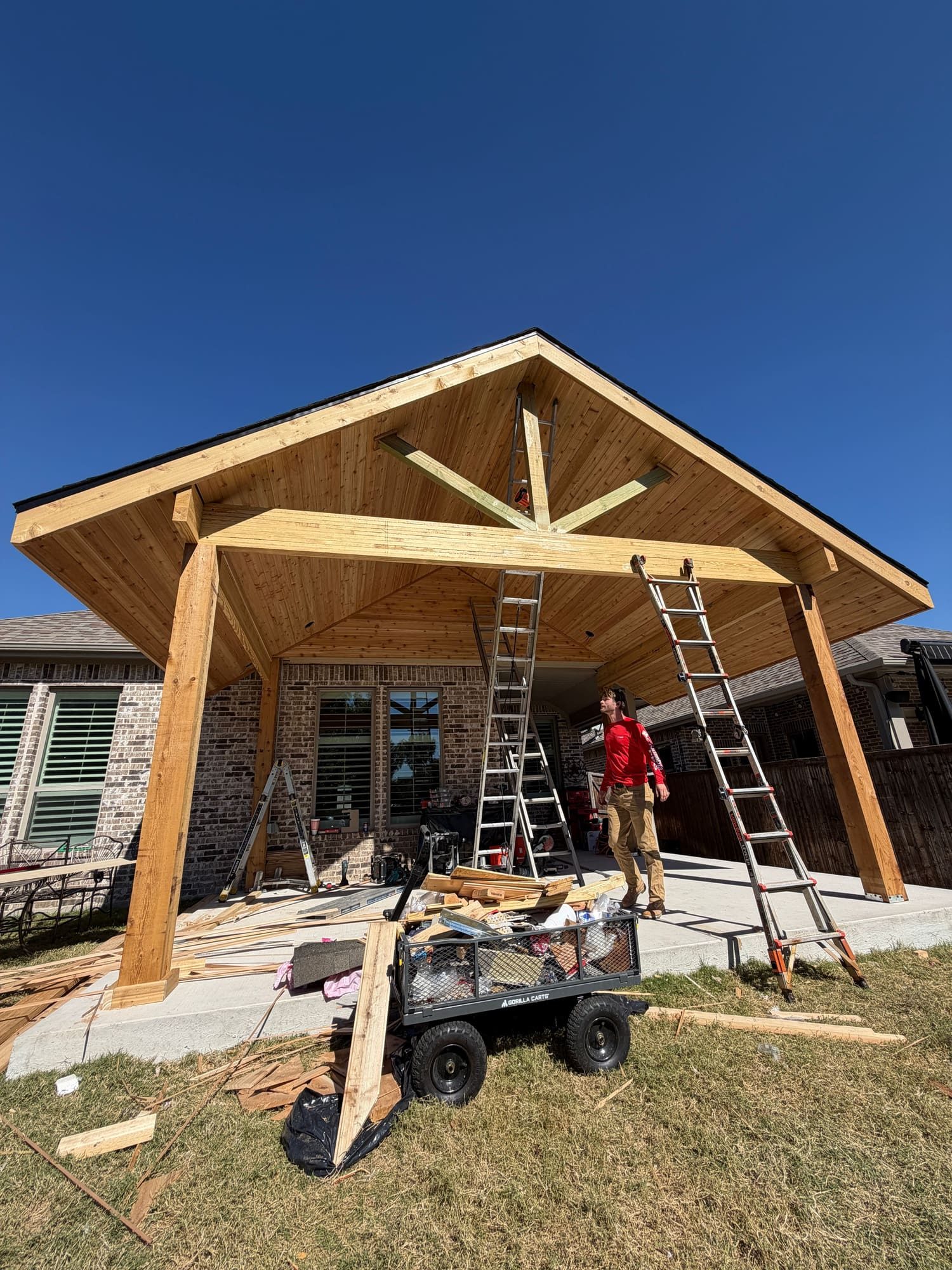 Gable patio cover framing in progress in McKinney, Texas