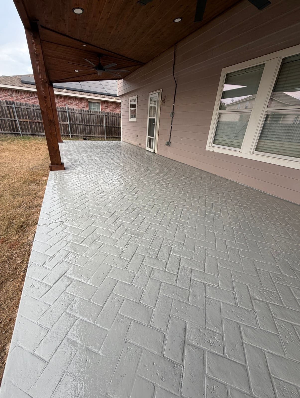 Herringbone brick-pattern stamped concrete