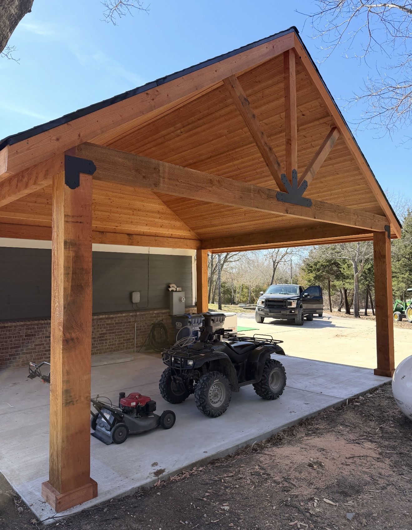 Custom gable patio cover with cedar posts and metal accents in Dallas-Fort Worth Texas