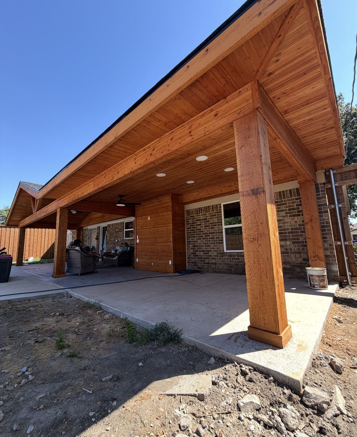 Cedar shed-roof wing with tongue-and-groove ceiling and recessed lighting on a home extension in Watauga, Texas